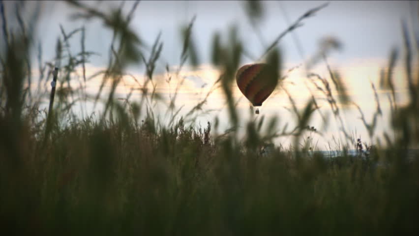 (1196) Hot Air Balloon Over Grassy Field Pasture Sunrise. Themes of summer, adventure, exploration, flying, nostalgia, fun, rural lifestyles, country