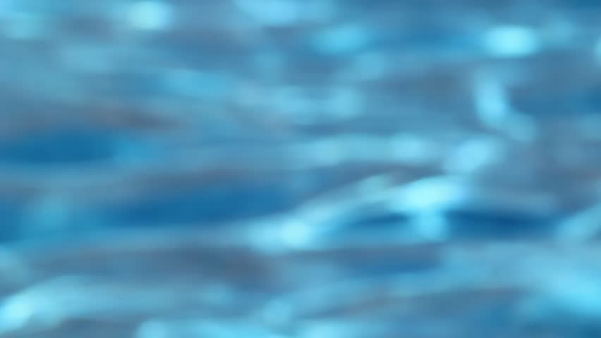 Abstract blur of blue water in swimming pool