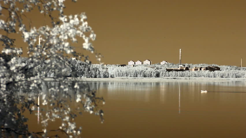 Infrared Finland: small boat moving in a bay 1 