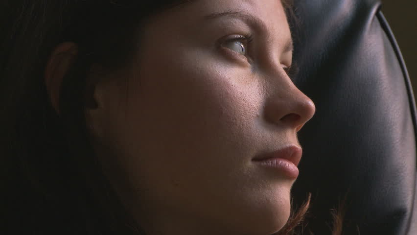 Side view portrait of young woman gazing