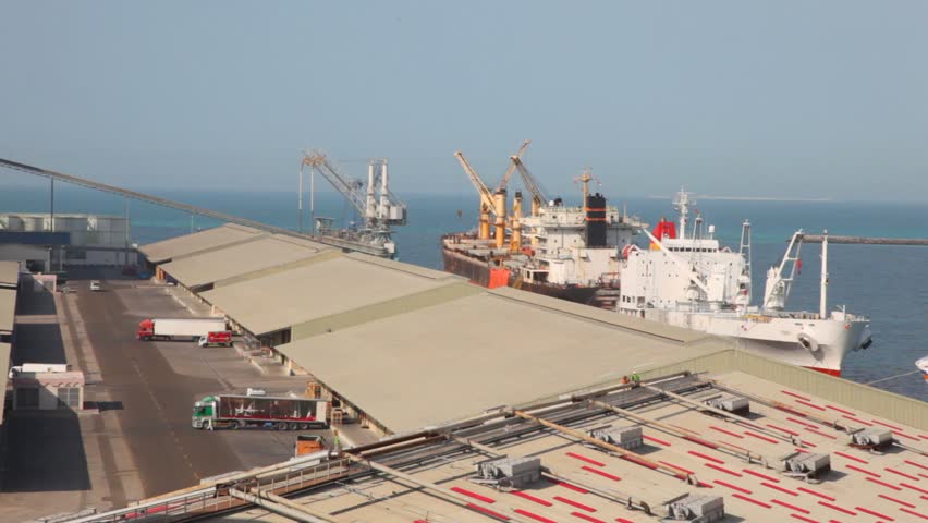 trucks and ship in seaport during shipment in Abu Dhabi, UAE
