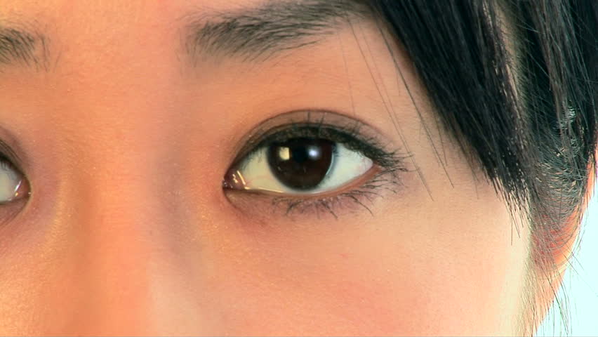 Close up portrait of young Asian woman eye blinking