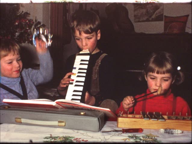 Children playing instruments (vintage 8 mm film)