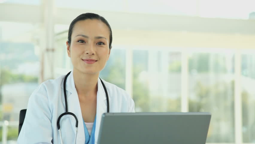 Female Doctor with a Laptop
