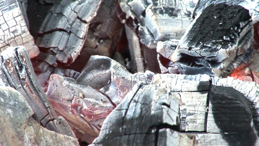 Coals burning in a BBQ, closeup