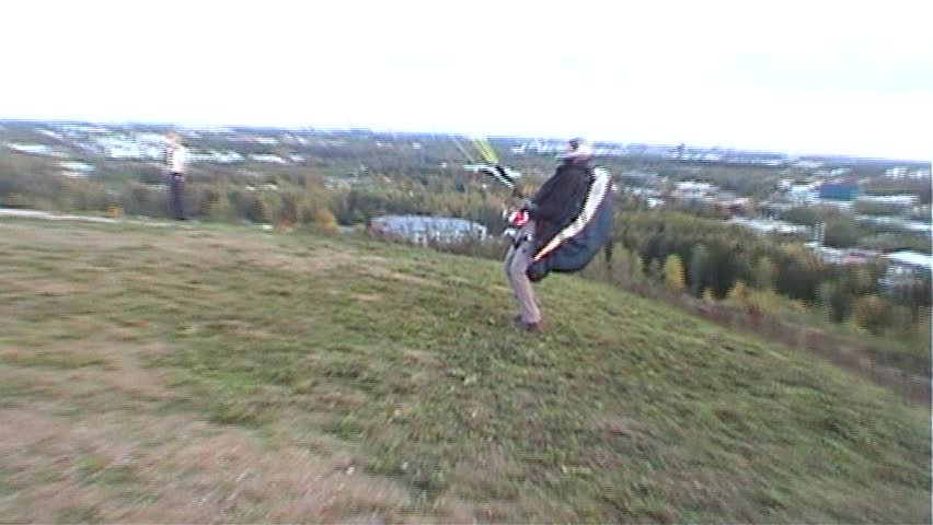 Unsuccessful paraglider start two,  tripod, 16x9