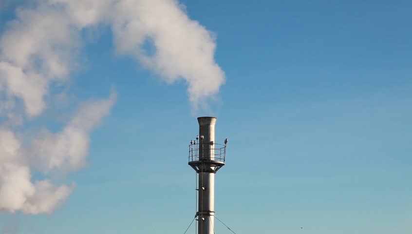 Chimneys releasing a fantastic amount of smoke. Ideal image to highlight climate change, global warming and greenhouse issues.