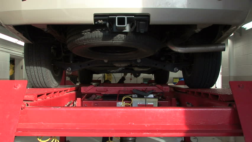 Female technician closes oil valve