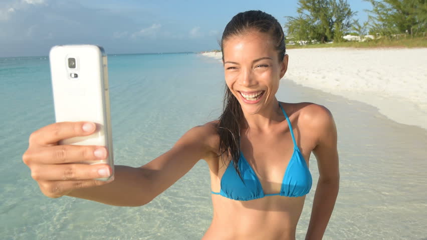 POV Young Caucasian Woman Is Taking Selfies On The Beach Concept Of