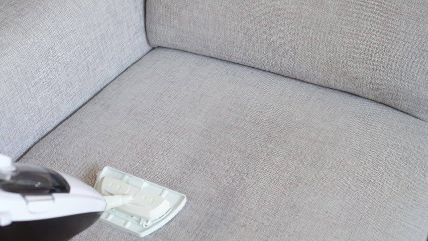 Cleaning Fabric Of The Sofa With A Steam Cleaner Fabric Of The Sofa With A Steam Cleaner