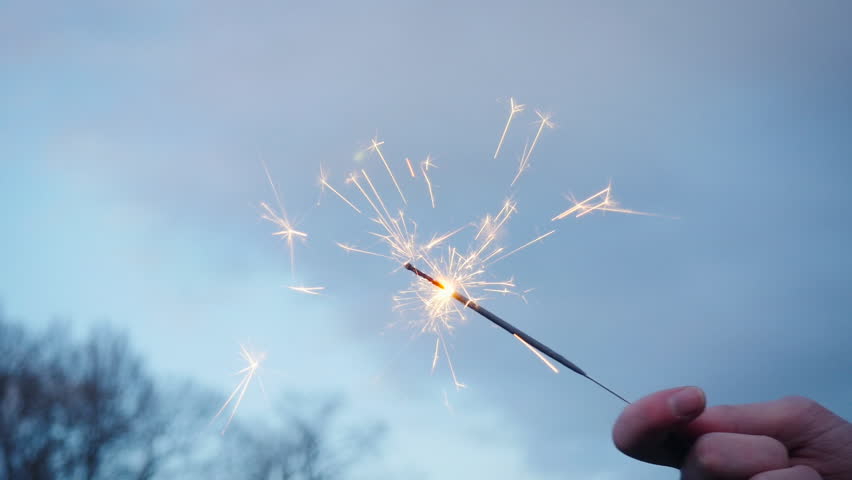 Holding a Burning Gold Sparkler Stock Footage Video (100% ...