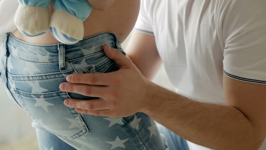 Guy Kisses The Belly Of His Pregnant Blonde Wife Standing By The Window Guy Kisses The Belly Of His Pregnant Blonde Wife Standing By The Window