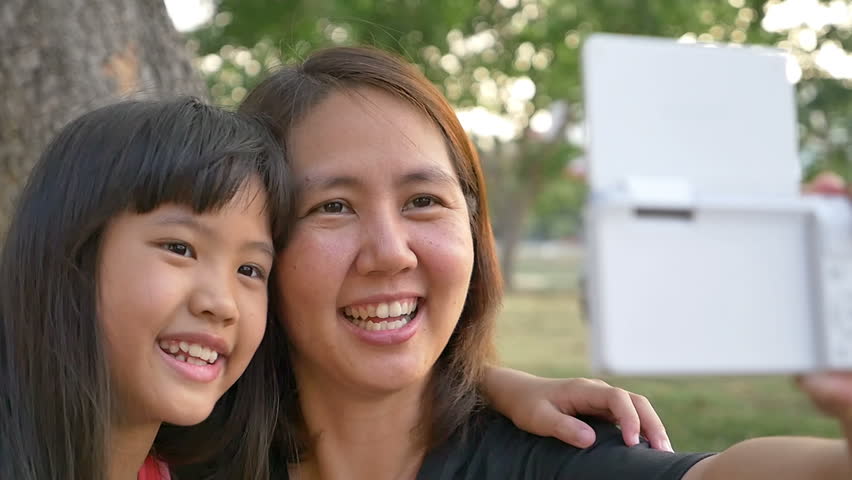 Asian Mother And Daughter Taking Selfie 10122329 Shutterstock