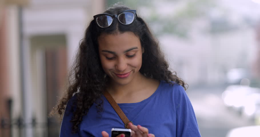 4k00 13portrait Of Pretty Smiling Mixed Race Teen Girl Using Her