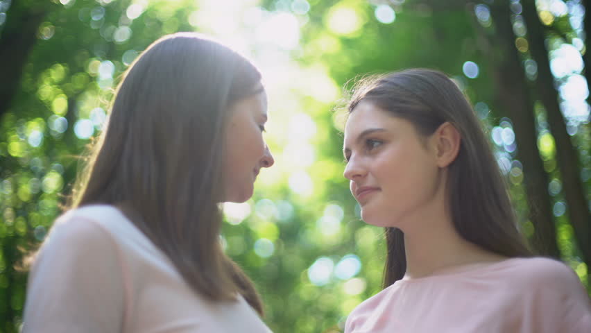 Lesbian Couple Talking Intimately, Kissing Stock Footage