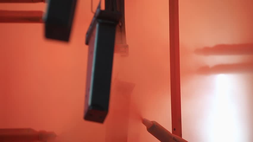 Painting Profiles At The Factory Stock Footage Video 100 Royalty Painting Profiles At The Factory In Orange Paint Conveyor Paints Metal Profile Hang On And Go To