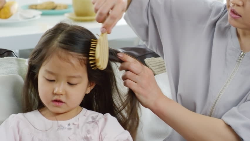 Asian Mother Brushing Long Hair Stock Footage Video 100