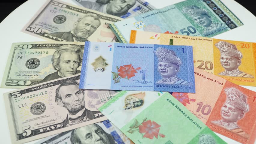 Us Dollar And Malaysia Money Stock Footage Video 100 Royalty Us Dollar And Malaysia Money On The Table Rotating 4k