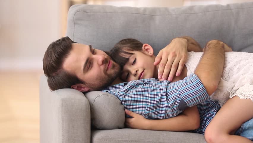 Hd00 06happy Father Lying On Sofa Hugging Cute Little Girl Rest On