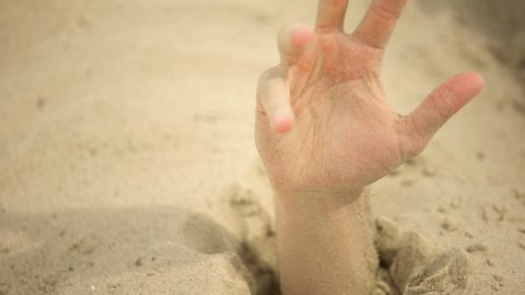Hand Desperately Waving Sinking In Quicksand Trapped Tourist In Desert Danger