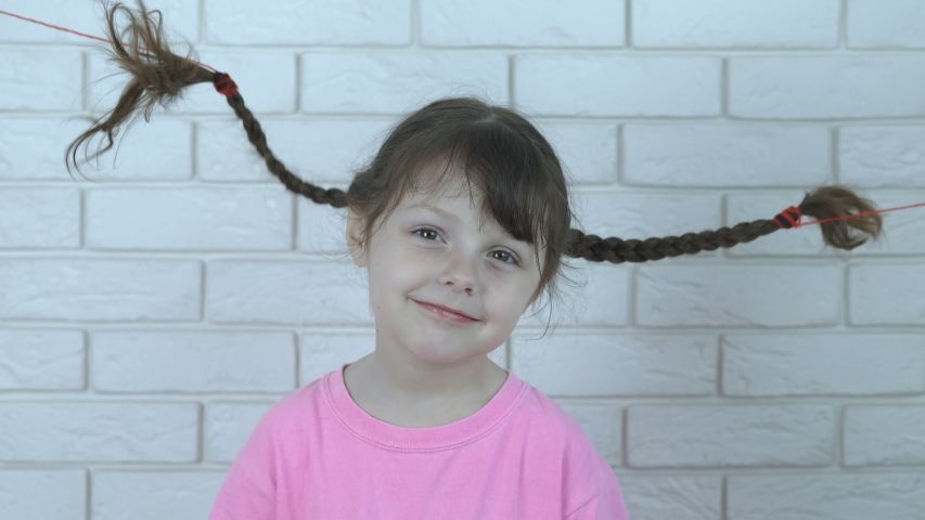 Funny Kid With Pigtails Portrait Of A Beautiful Little Girl With Dancing