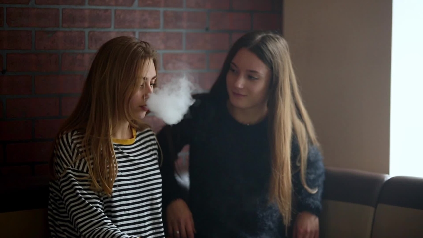Teenage Girls Smoking An Electronic Stock Footage Video 100