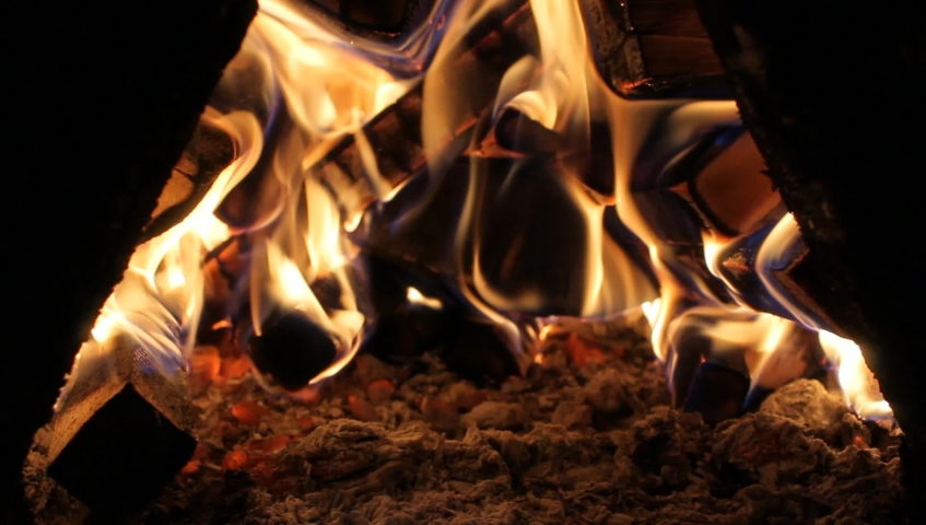 Fire Burns In The Boiler Of A Home Heating System