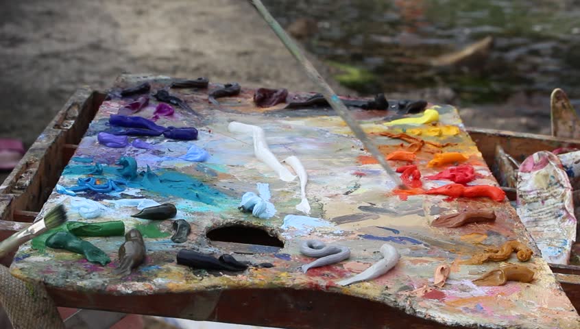 an-artist-s-palette-with-oil-paint-close-up-a-painter-arranges-and