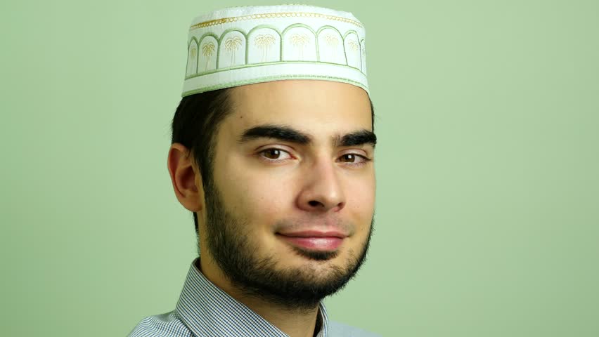 Portrait Of A Young Arabic Muslim Man Wearing A Typical Beard And Hat ...