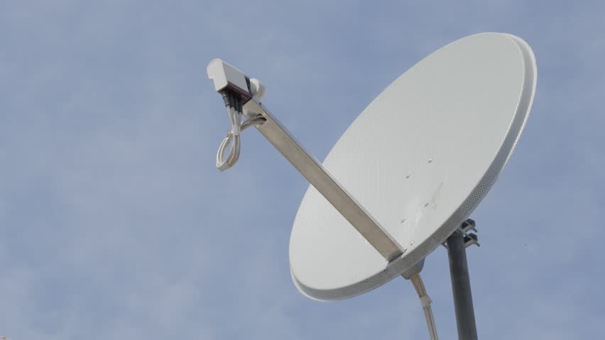 black antenna communication satellite dish over sky time lapse
