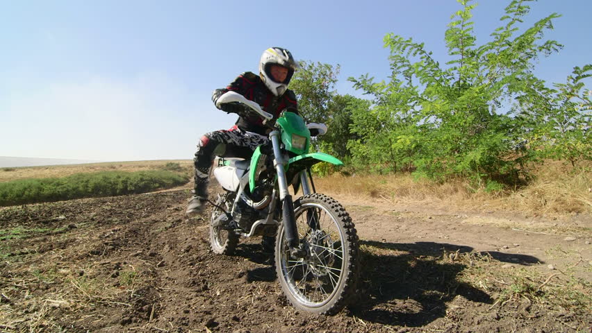 Low Angle Shot Of Motocross Rider Landing After Jump In Slow Motion ...