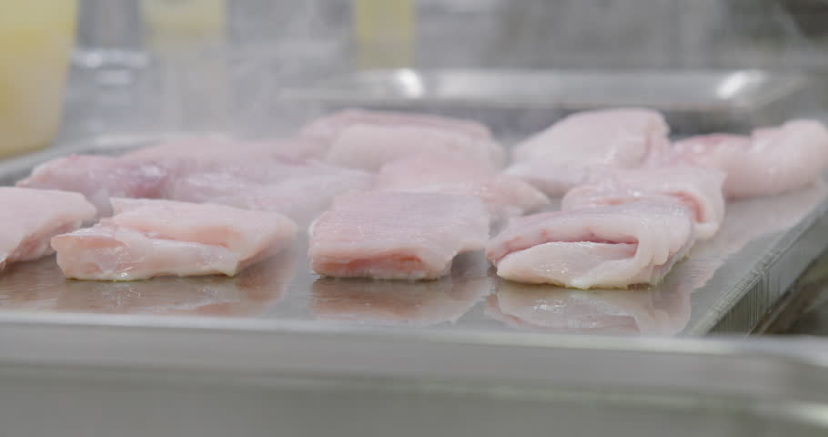 Restaurant Kitchen Video baking fish on a teppanyaki restaurant kitchen stock footage video Restaurant Kitchen Video baking fish on a teppanyaki restaurant kitchen stock footage video