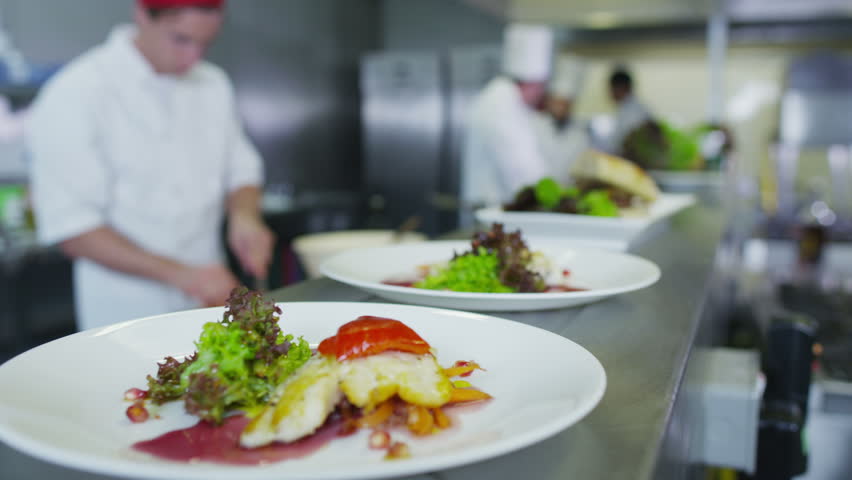 professional chefs arranging their schedule in a restaurant or professional chefs arranging their schedule in a restaurant or