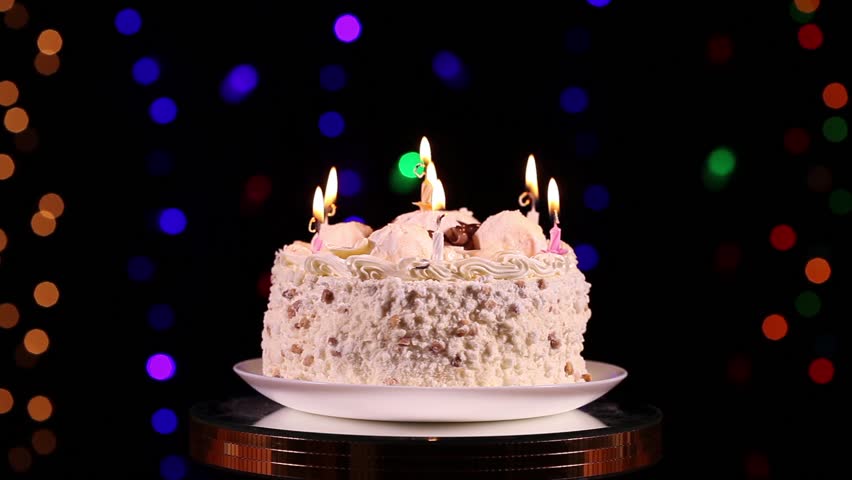 Happy Birthday Cake With Burning Candles In Front Of Black Happy Birthday Cake With Burning Candles In Front Of Black