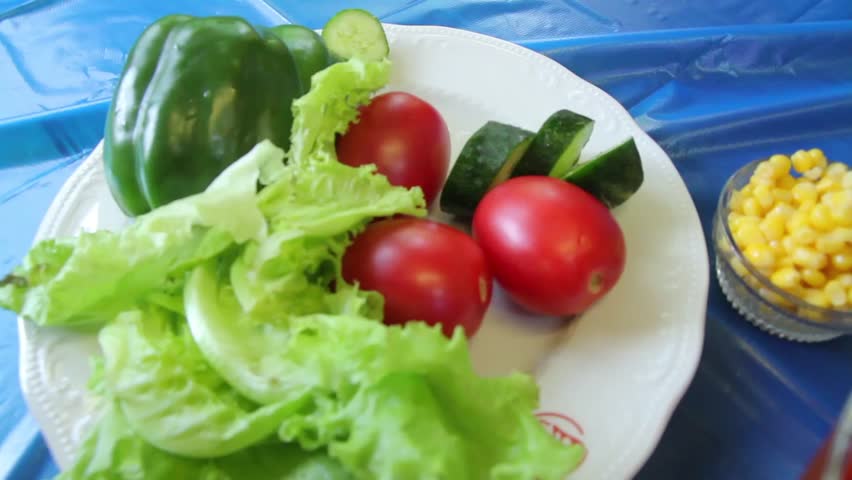 Hands Decorating With Green Peas Dish Of Fresh Vegetables