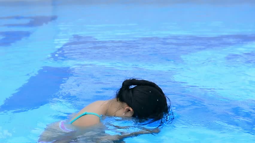 Pool Water With Beach Ball child playing beach ball in swimming pool. stock footage video Pool Water With Beach Ball child playing beach ball in swimming pool. stock footage video