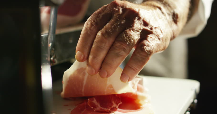 old hand experienced slices Parma ham Italian very fine and he savored the taste and goodness