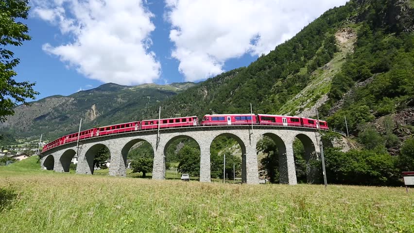 Red Train From Tirano To The Switzerland On The Viaduct Of Brusio Stock ...