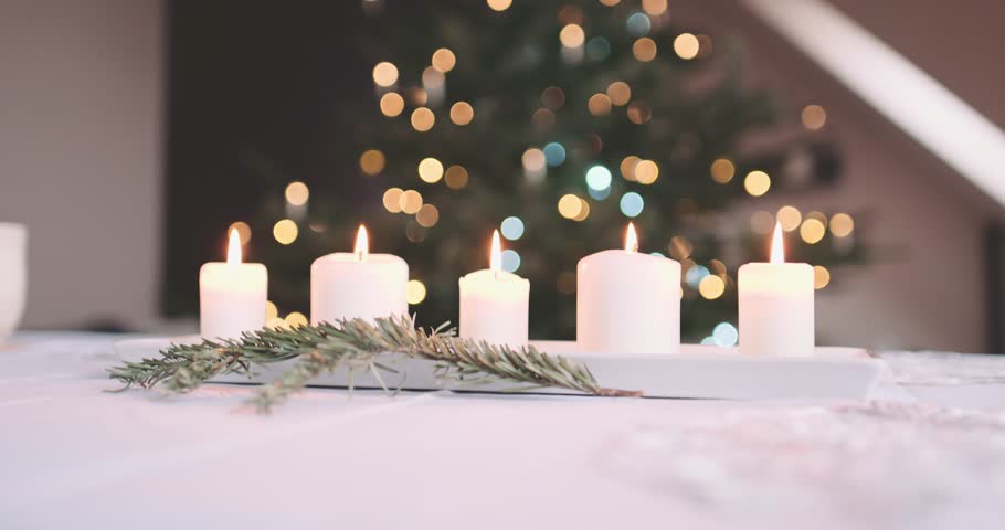 Dinner Table Background candles burning on the table in front of abstract blurred Dinner Table Background candles burning on the table in front of abstract blurred