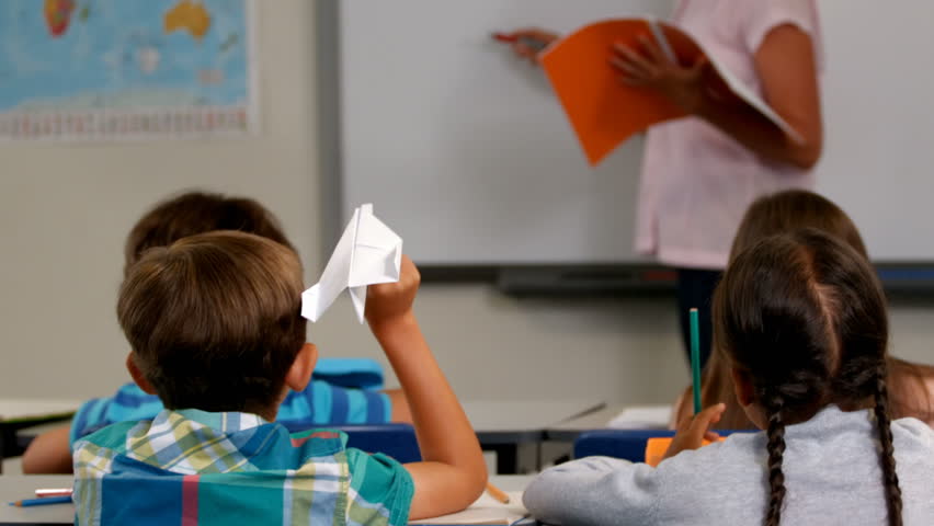 Hd00 11rear View Of Caucasian Boy Throwing Paper Plane While