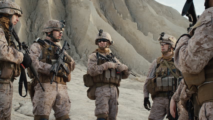 Group Of Soldiers Are Standing In A Circle And Listening Orders From ...