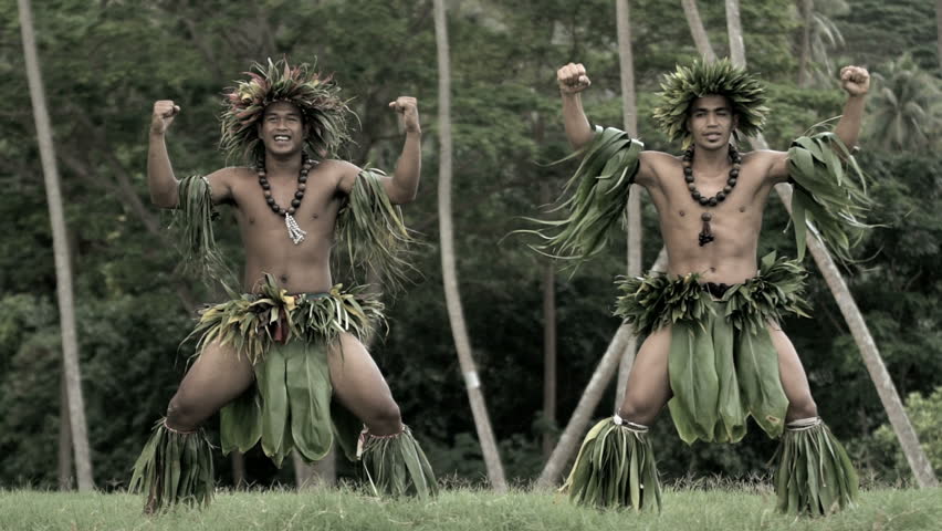 Polynesian Young Men In Traditional Grass Skirts With Flower Headdr pic
