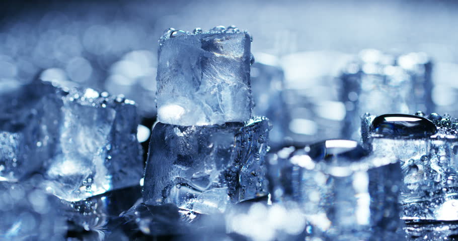 Macro Shot Of Pure Water Ice Cubes That Melt In Slow Motion On Black ...