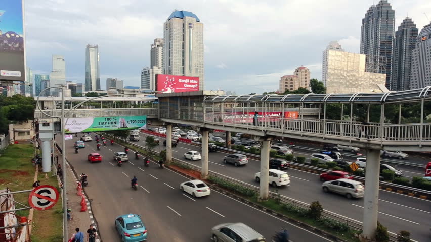 JAKARTA, INDONESIA - FEBRUARY 16 2016: Traffic With A Separated Bus ...