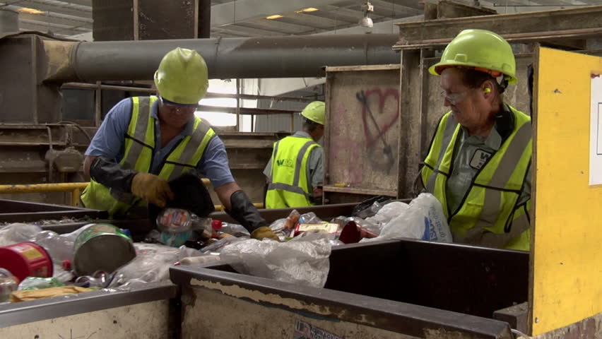 ORLANDO, FL - CIRCA 2009: Workers On Assembly Line Sort Through Paper ...