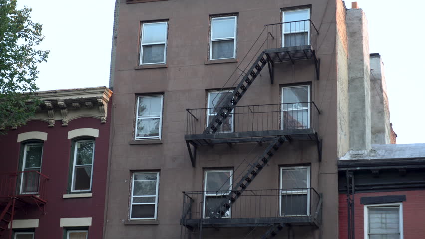 Apartment Building Exterior exterior wide establishing shot of a vintage brick office or Apartment Building Exterior exterior wide establishing shot of a vintage brick office or