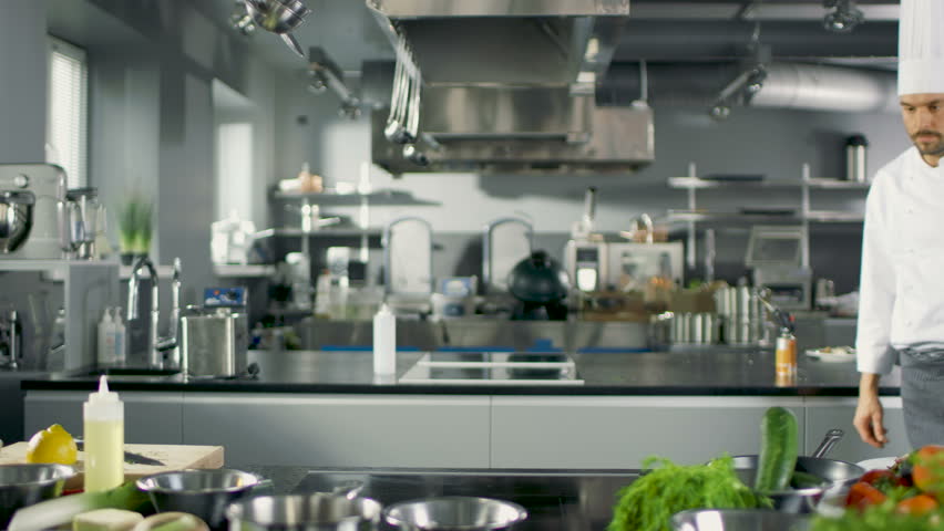Restaurant Kitchen Window minsk -january,7,2015 chefs preparing food in the kitchen Restaurant Kitchen Window minsk -january,7,2015 chefs preparing food in the kitchen