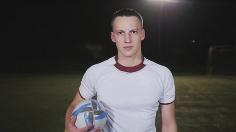 Soccer player standing portrait, football or rugby player professional men outdoor on stadium