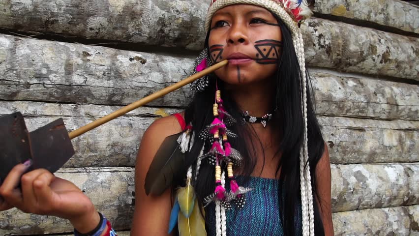 Indigenous Woman Smoking Pipes In A Tupi Guarani Tribe, Brazil Stock ...