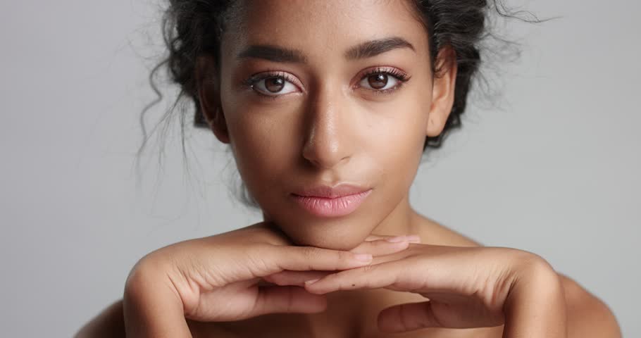 Cute Young Middle Eastern Model With Nude Shoulders And Lightly Braided